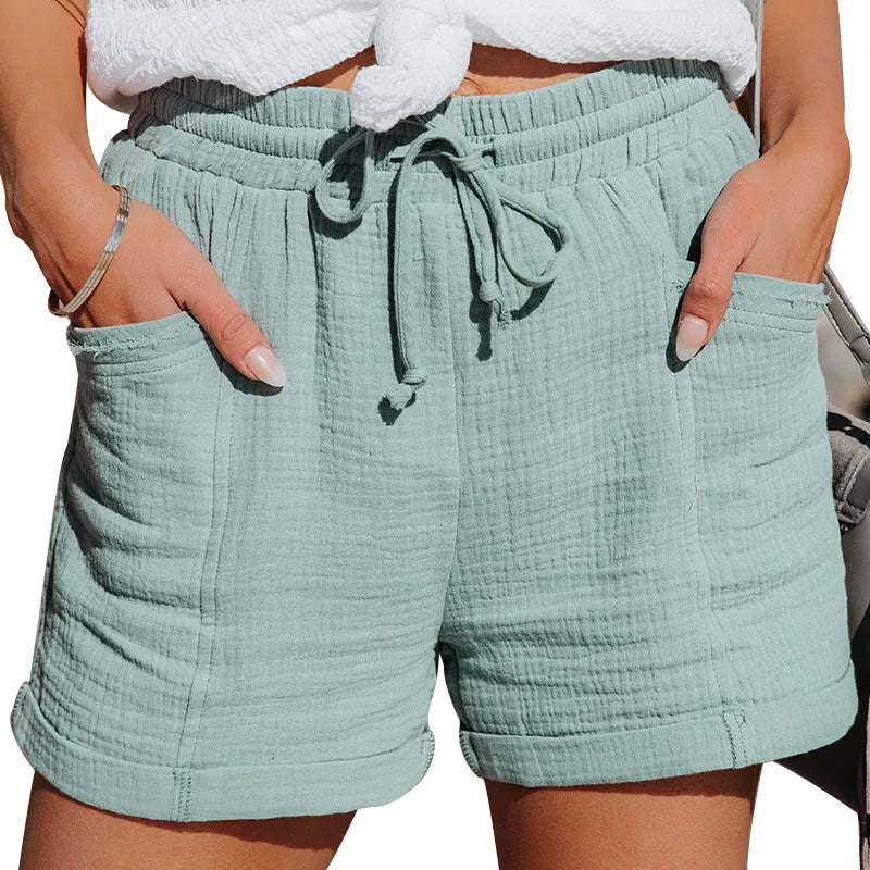 Soft women's casual shorts with elastic drawstring waist and practical pockets for summer comfort.