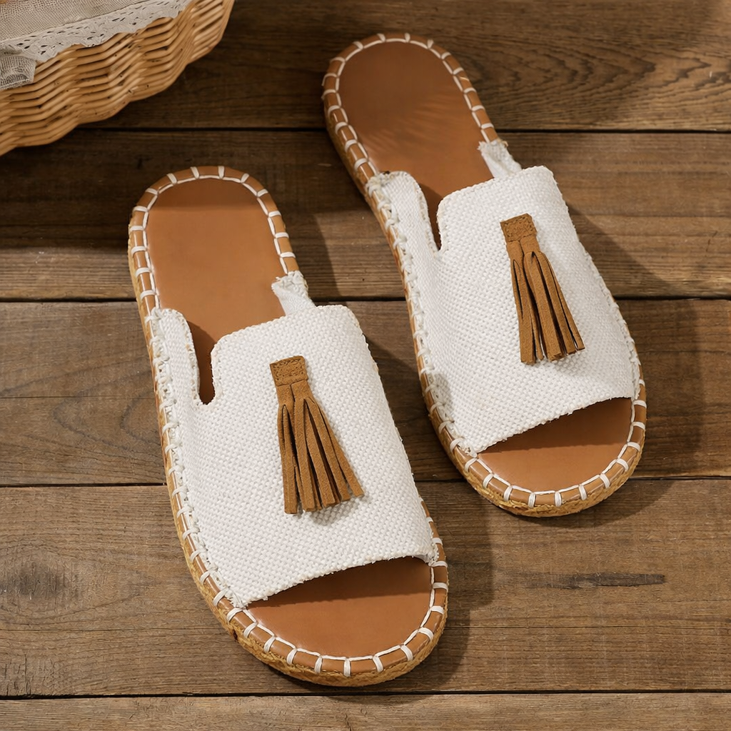 Stylish women's open-toe flat sandals, ideal slip-on footwear for walking & vacation.