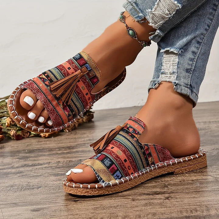 Chic women's slip-on flat sandals, perfect everyday footwear for comfy summer styling.