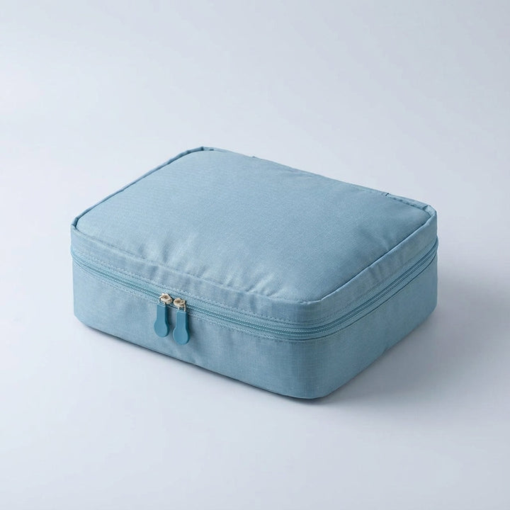 Small waterproof beauty storage bag for women, portable travel makeup case & cosmetic organizer.
