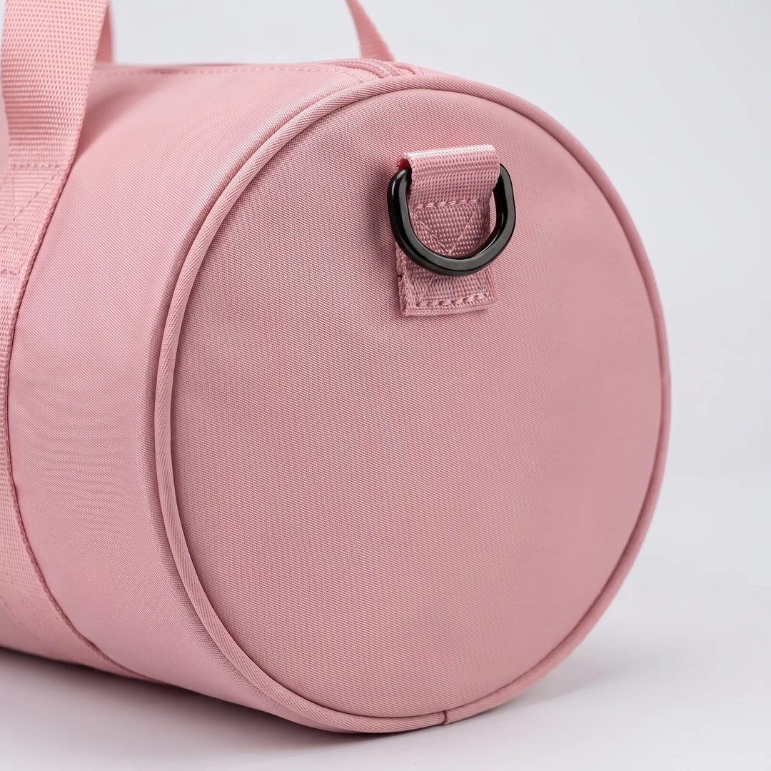Lightweight nylon gym bag for women, water-resistant, ideal for daily workouts or short trips.