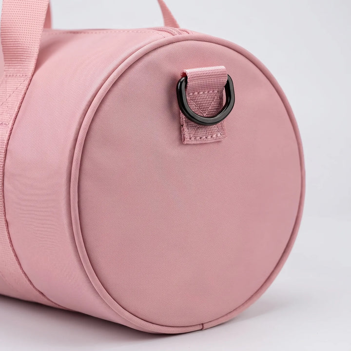 Lightweight nylon gym bag for women, water-resistant, ideal for daily workouts or short trips.