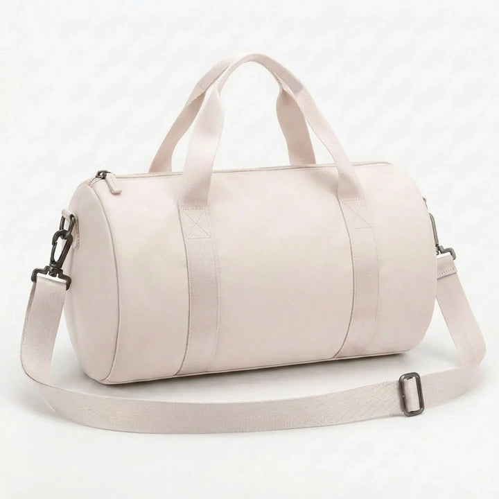 Durable compact sports bag for women, featuring water-resistant material and comfortable handles.