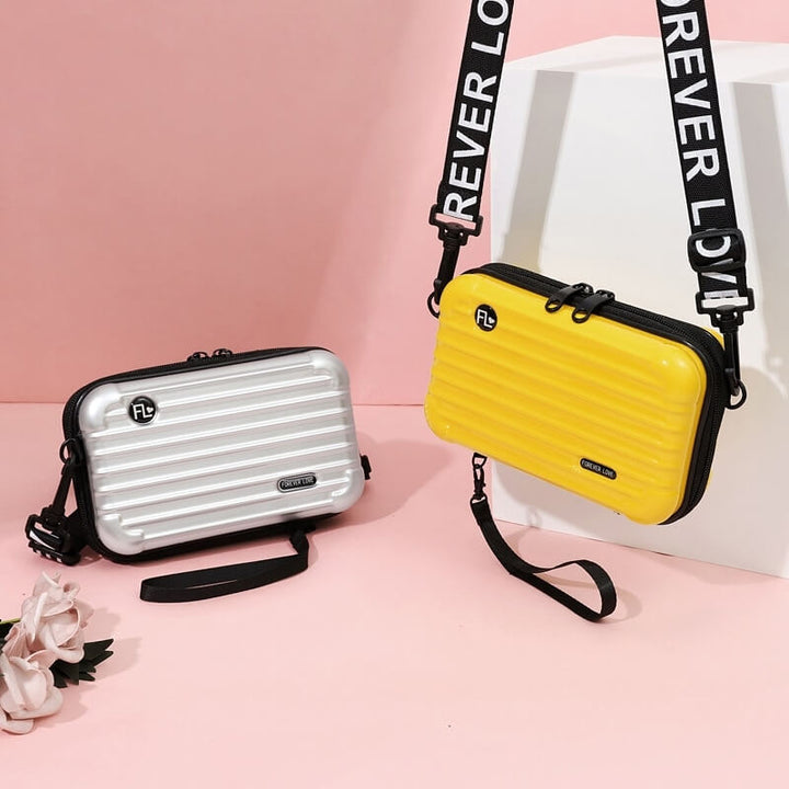 Versatile women's compact hard shell crossbody bag. Use as travel handbag, shoulder bag or mini accessory.
