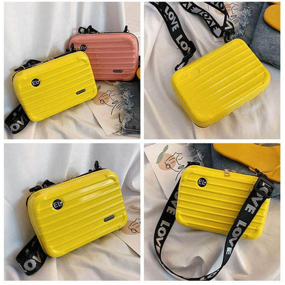 Chic women's hard shell crossbody bag. Fashionable compact mini handbag for modern women on the go.