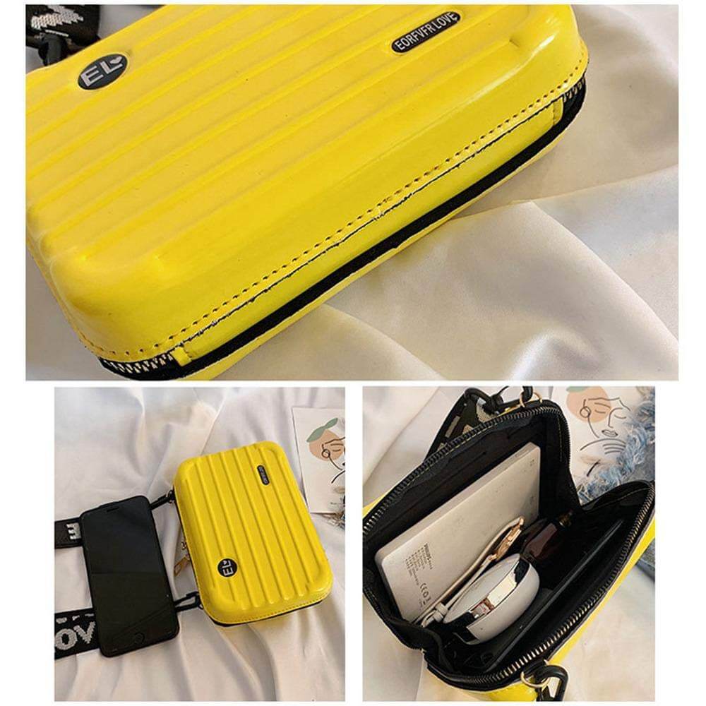Organized women's hard shell crossbody travel bag. Compact mini handbag with secure zipper for essentials.