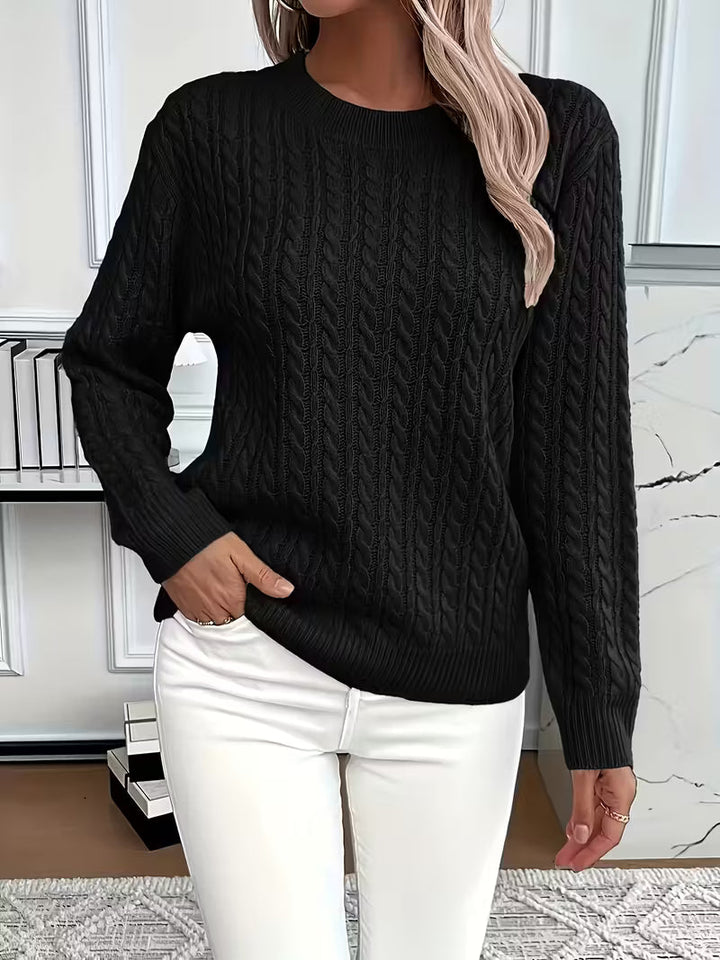 Plush, soft women's cable knit crew neck sweater, providing ultimate cozy comfort for autumn season.