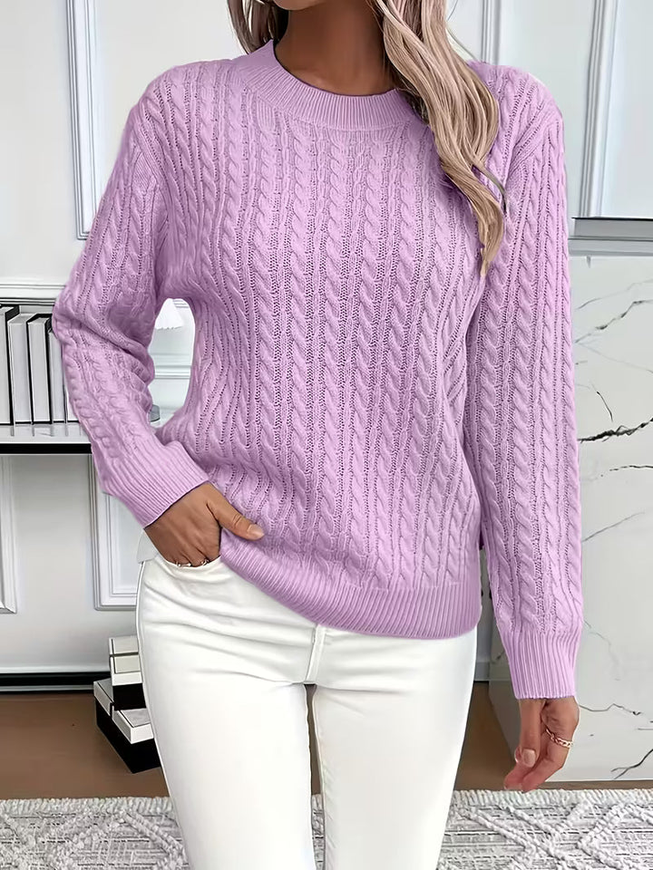 Versatile women's cable knit crew neck sweater. Great for casual or dressed-up autumn, essential layering.