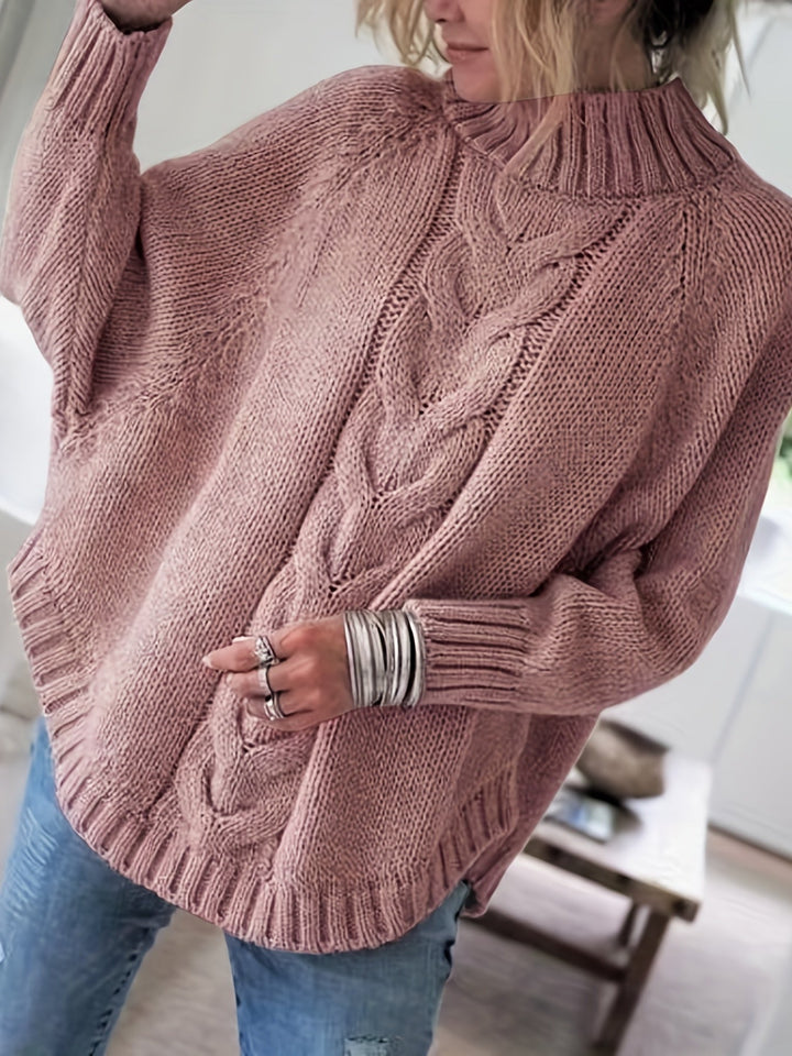Women's cozy cable knit high-neck sweater with a chic flared hem, perfect for fall and winter.