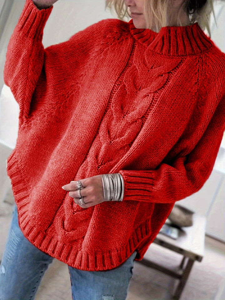 Women's batwing sleeve cable knit sweater with a high neck & flared hem. Ideal for casual comfort.
