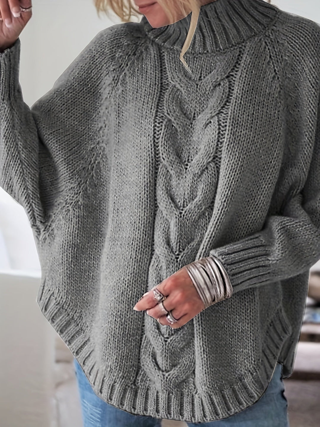 Everyday women's cable knit high-neck sweater with flared hem. Cozy & chic for fall/winter layering.