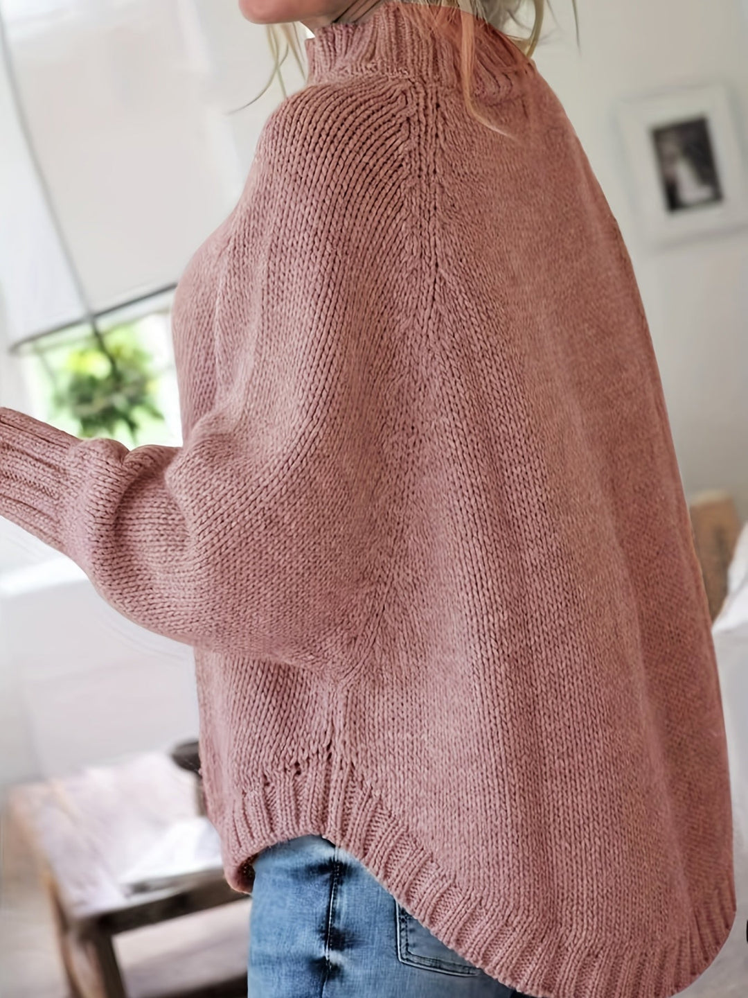 Super cozy women's high-neck cable knit sweater. Oversized fit & flared hem for ultimate comfort.