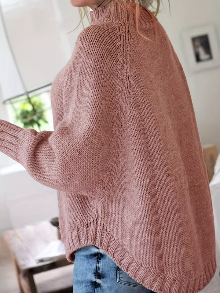 Super cozy women's high-neck cable knit sweater. Oversized fit & flared hem for ultimate comfort.