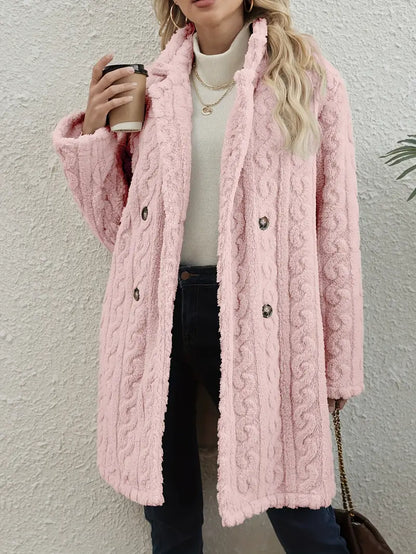 Chic women's cable knit overcoat for winter. Elegant and warm long jacket, ideal for stylish layering outerwear.