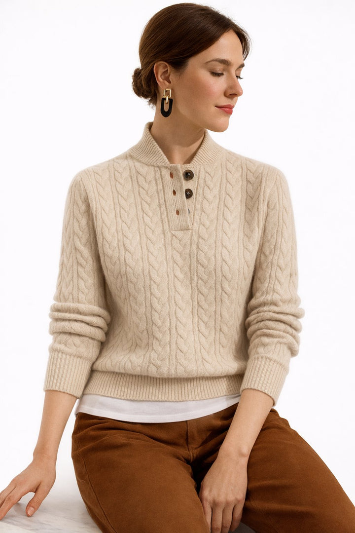 Elegant women's cable knit pullover sweater with button neck, a versatile top for smart casual fall outfits.