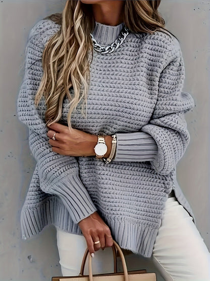 Fashionable women's oversized chunky knit sweater in a soft fabric, ideal for winter layering.