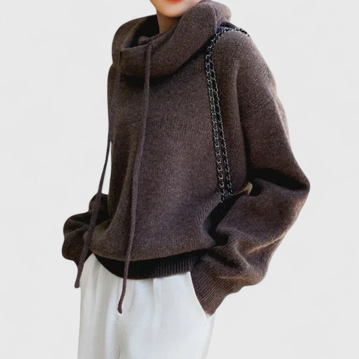 Soft knit women's long sleeve sweater featuring a stylish cowl neck and drawstring, ideal for winter fashion.