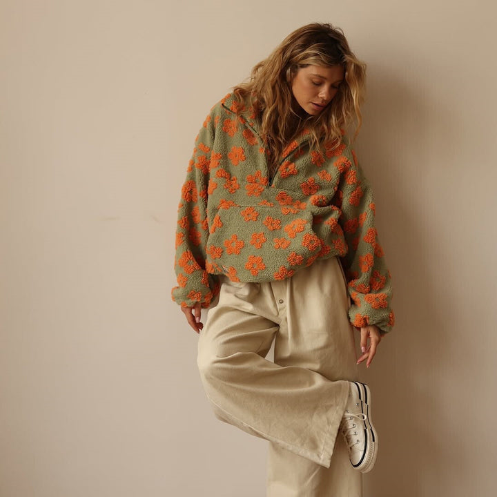 Casual floral sherpa fleece sweater for women. Oversized, cozy, and warm, ideal for fall/winter layering.