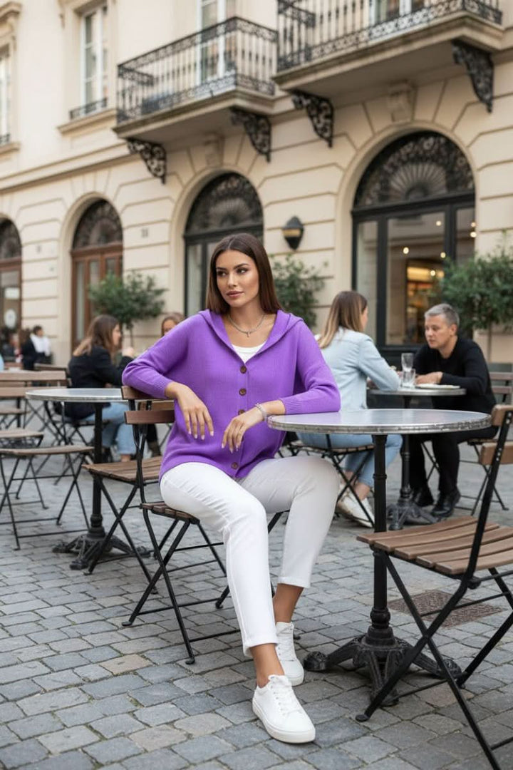 Women's hooded knit cardigan sweater in a relaxed fit, offering effortless style and warmth.