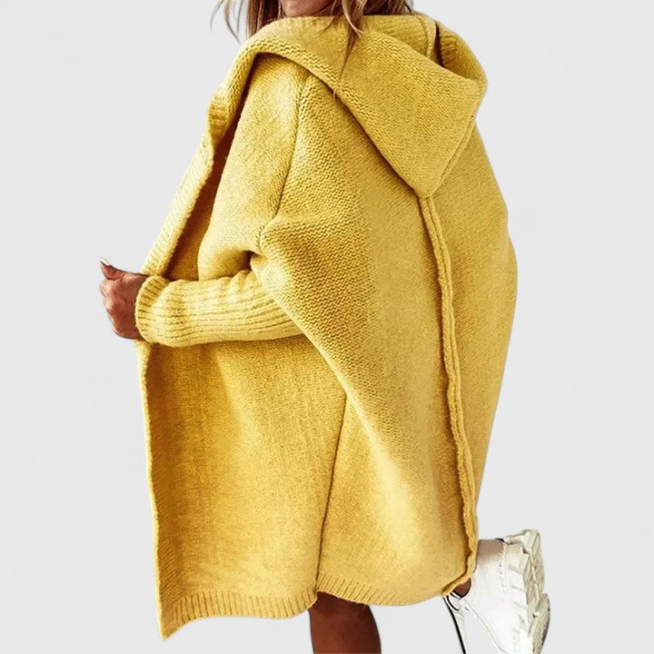 Oversized hooded knee-length open-front cardigan for women, perfect casual fall fashion layering piece.