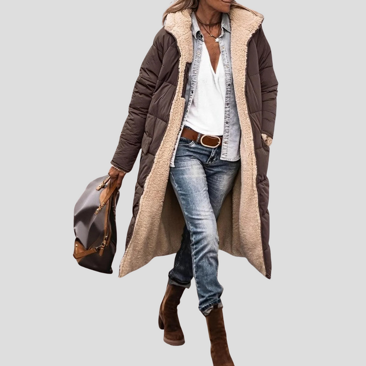 Long women's reversible hooded winter coat, providing cozy warmth and cold weather protection.