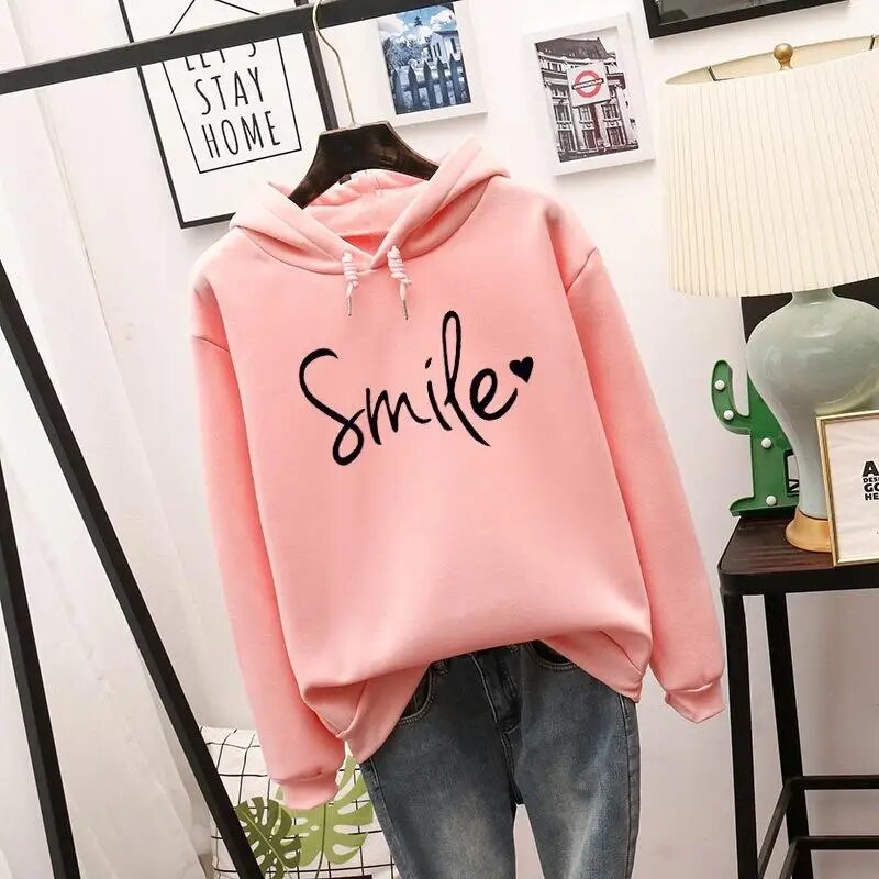 Relaxed fit women's graphic hoodie, super cozy with a cheerful smile design. Ideal for everyday casual wear.