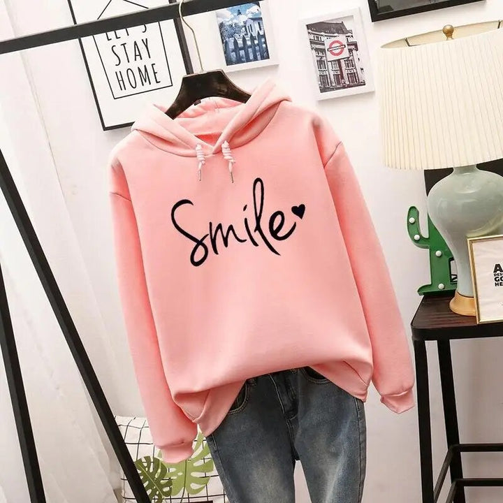 Relaxed fit women's graphic hoodie, super cozy with a cheerful smile design. Ideal for everyday casual wear.