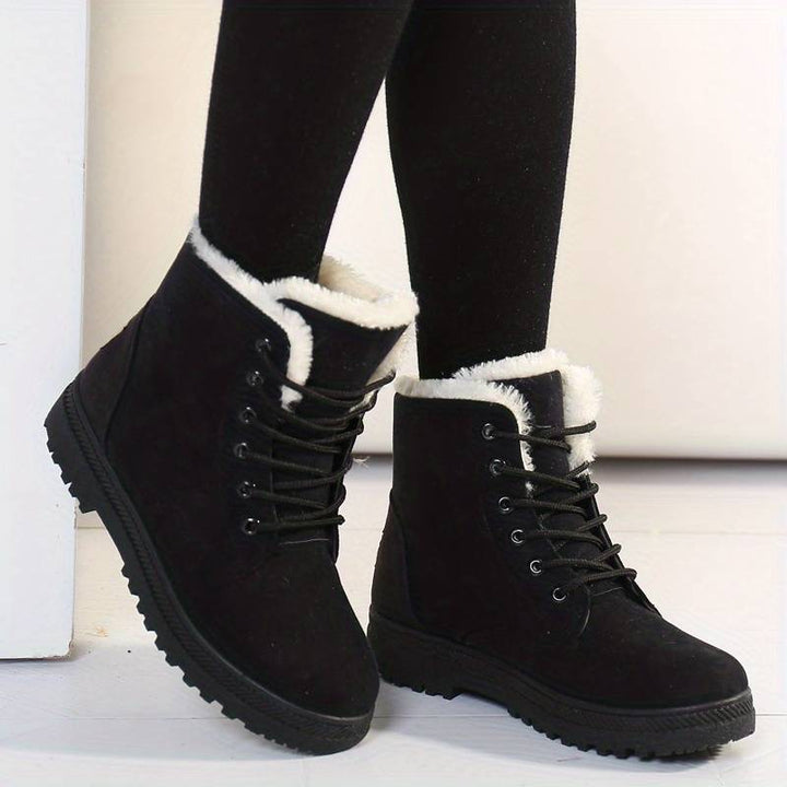 Women's cozy insulated winter boots for cold weather, non-slip, ankle-high outdoor footwear for comfort & style.