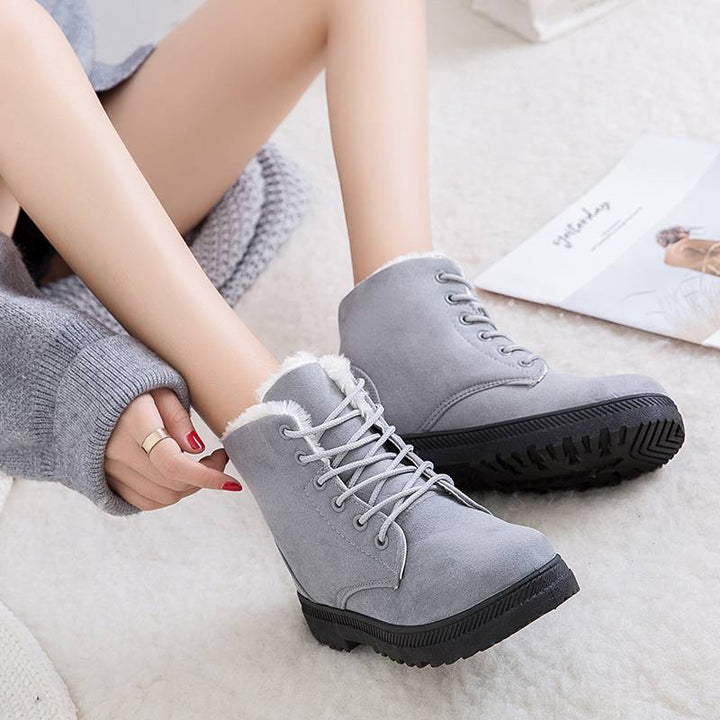Stylish women's insulated ankle winter boots. Cozy, cold weather outdoor footwear with non-slip sole for comfort.