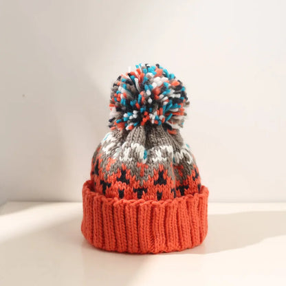 Fashionable women's snowflake pom beanie, a cozy and warm accessory for cold weather and casual style.