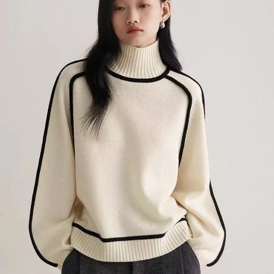 Women's cozy knit turtleneck pullover sweater in a loose fit, perfect for warm winter fashion & casual style.