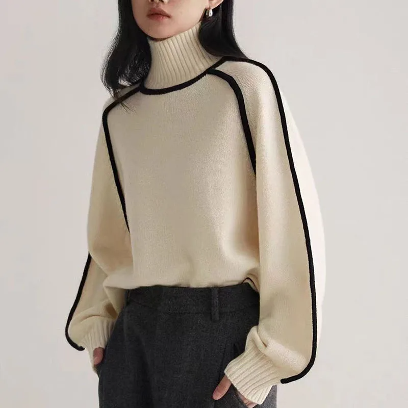 Chic women's long sleeve turtleneck pullover sweater. Comfortable, loose fit, and cozy knit for winter fashion.
