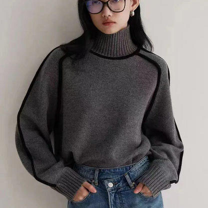Stylish women's turtleneck pullover sweater. Long sleeve, loose fit, and cozy knit for chic winter fashion outfits.