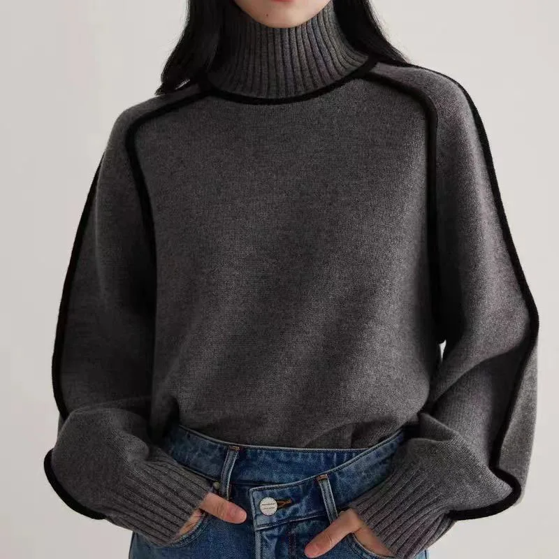 Cozy women's turtleneck pullover sweater. Warm knit, long sleeve, and comfortable loose fit for versatile winter styling.