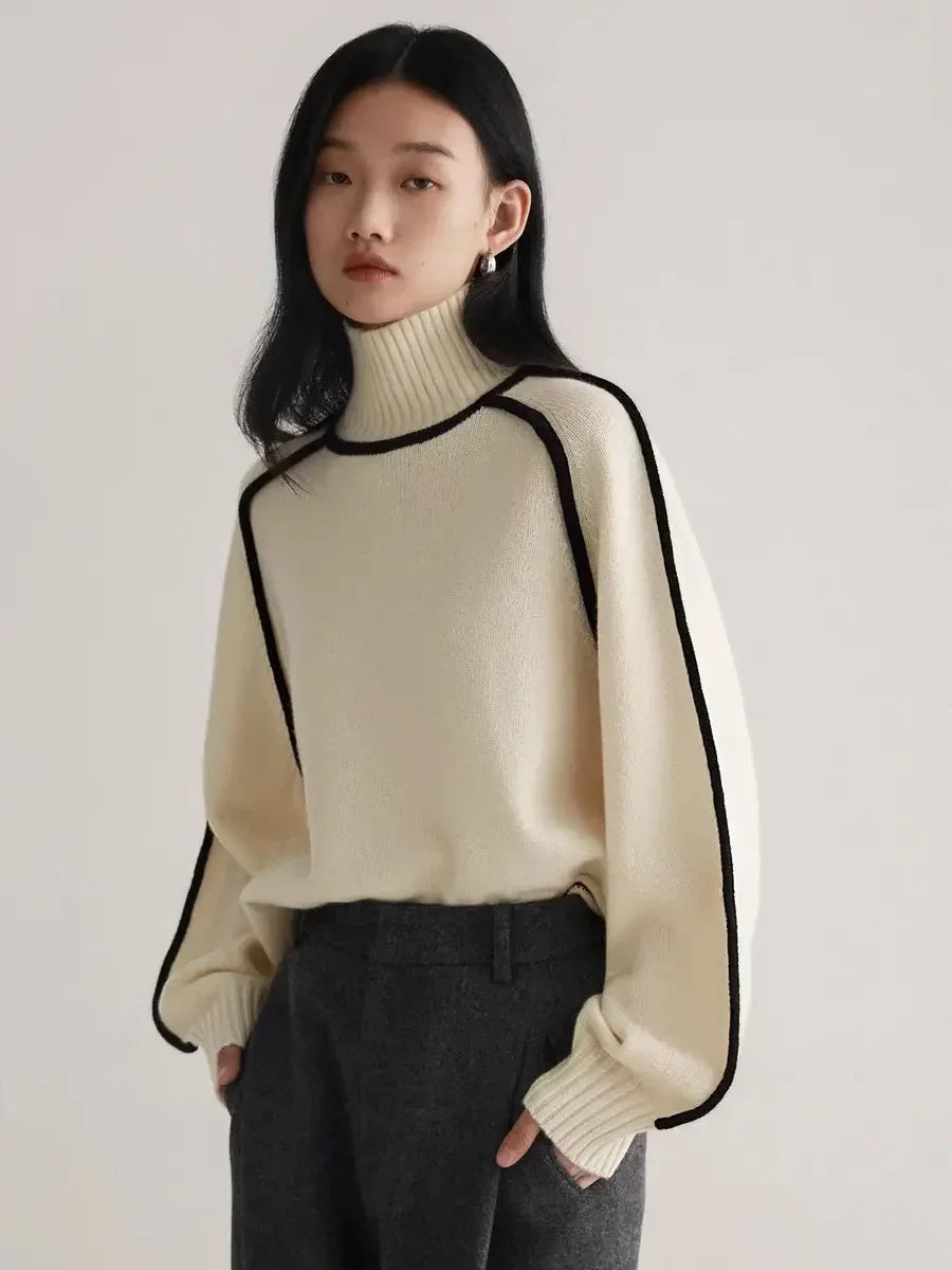 Chic women's knit turtleneck top with distinctive contrast seams. Versatile apparel for everyday style.