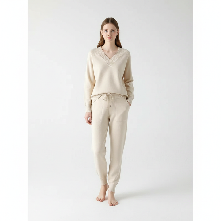 Stylish women's knit two-piece set featuring a v-neck sweater & matching trousers for autumn comfort.
