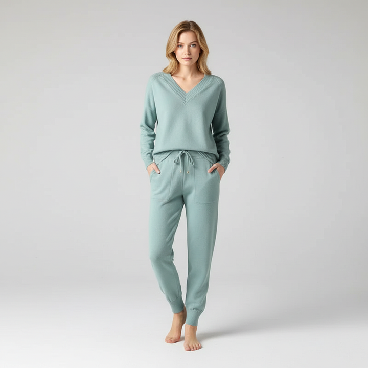 Elegant women's knit two-piece set with a relaxed v-neck top & comfortable matching trousers.