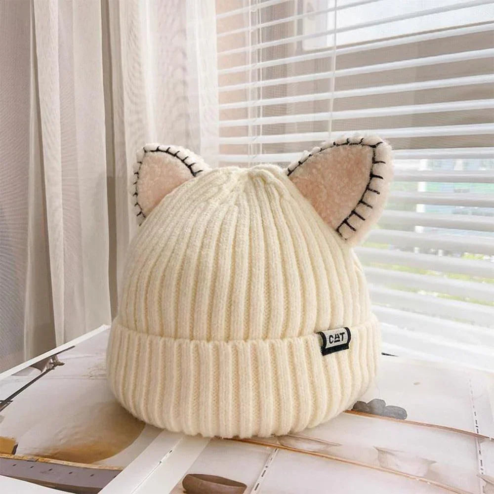 Women's cozy knit winter hat with playful cat ears, perfect for cold weather style.