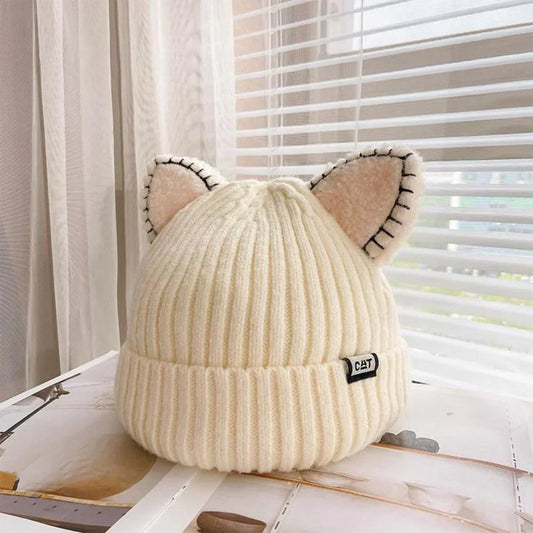 Women's cozy knit winter hat with playful cat ears, perfect for cold weather style.