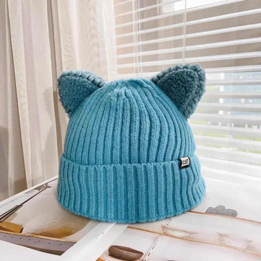 Stylish women's cat ear knit hat, a trendy and warm winter fashion accessory for cold weather.