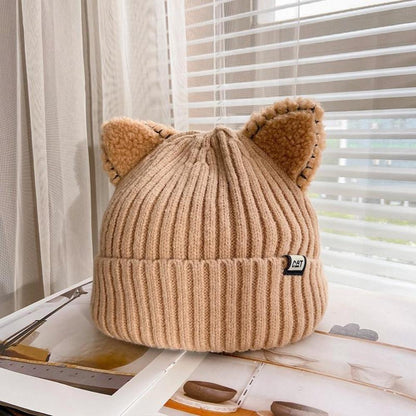 Soft, cozy women's knit winter hat featuring fun cat ears for playful cold-weather headwear.