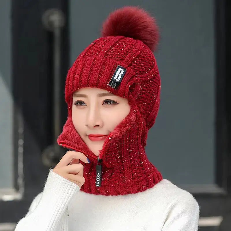 Comfortable women's knitted balaclava with pompom, a warm hat perfect for chilly days and winter activities.
