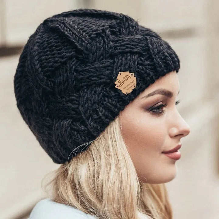 Stylish women's knitted beanie for winter. Warm, cozy, and a fashionable accessory.