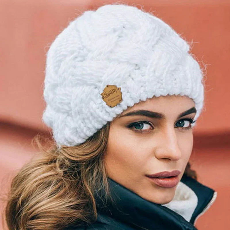 Women's warm knitted winter beanie hat. Cozy and stylish essential for cold weather fashion.