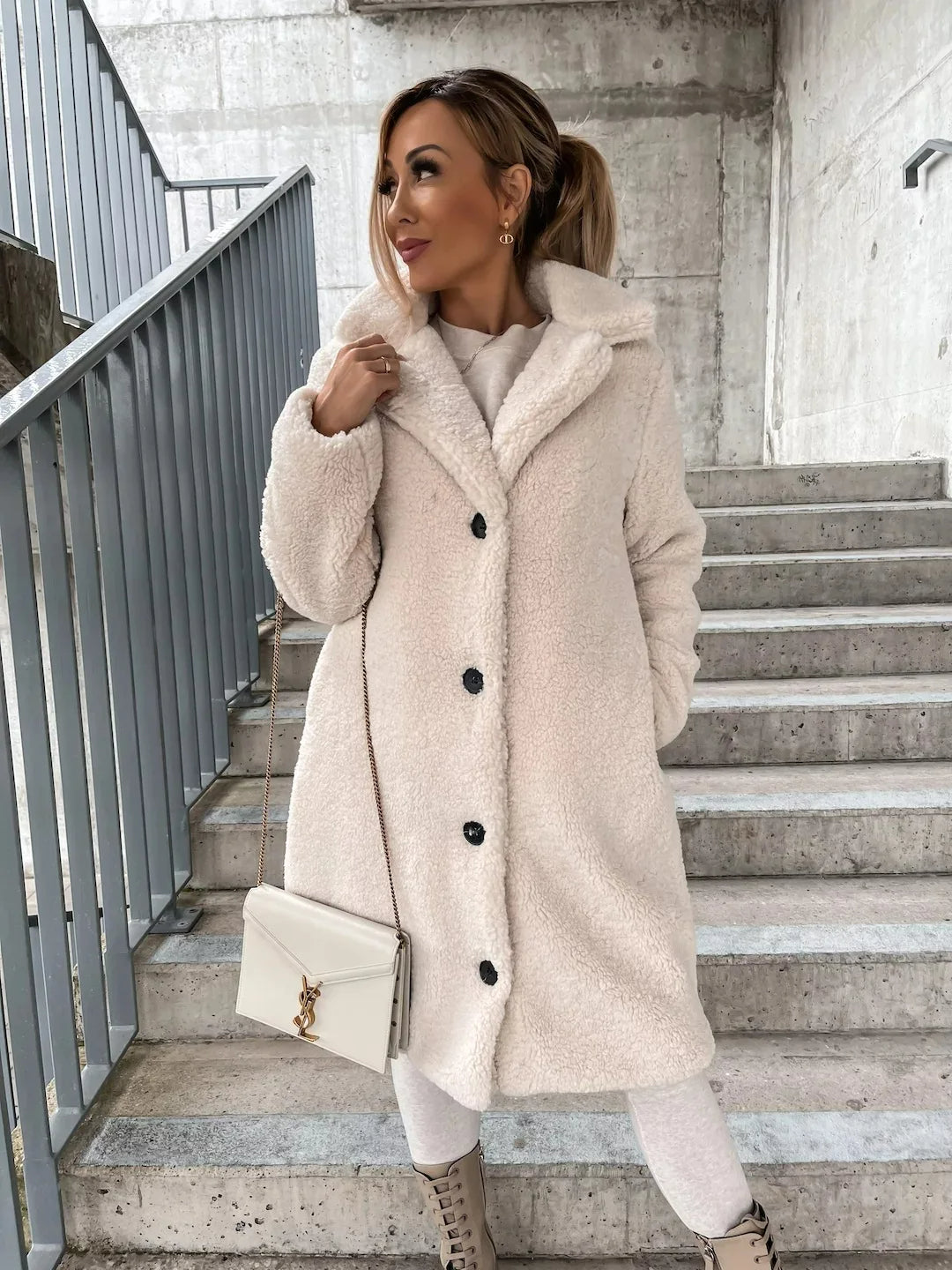 Soft and luxurious women's longline teddy coat, an elegant plush jacket for autumn and winter fashion.