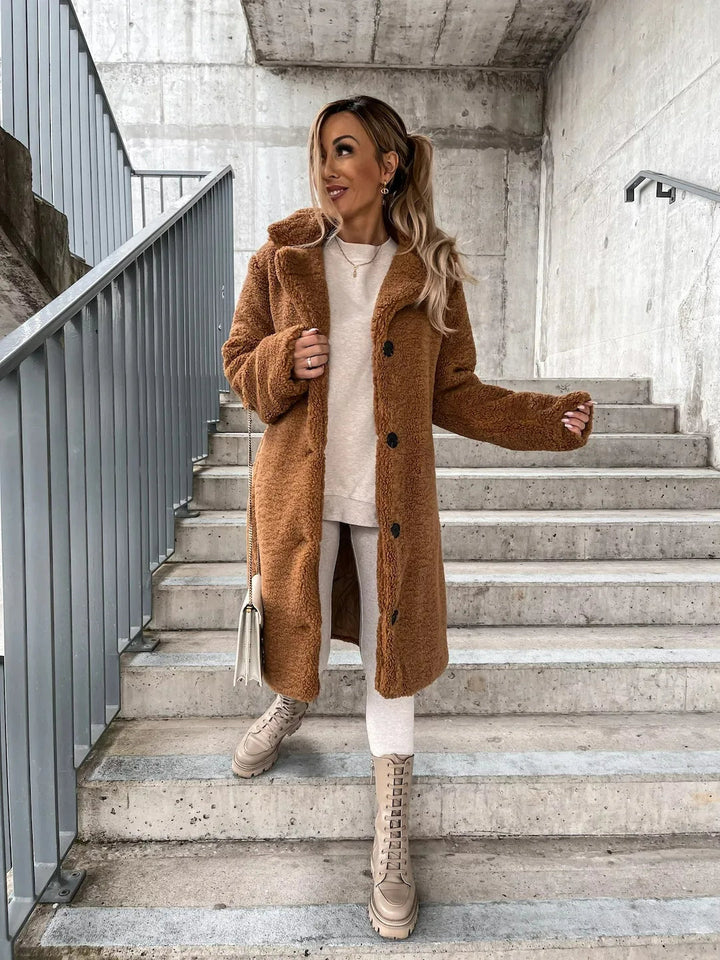 Embrace fall and winter with this cozy women's longline plush teddy coat, soft and warm outerwear.