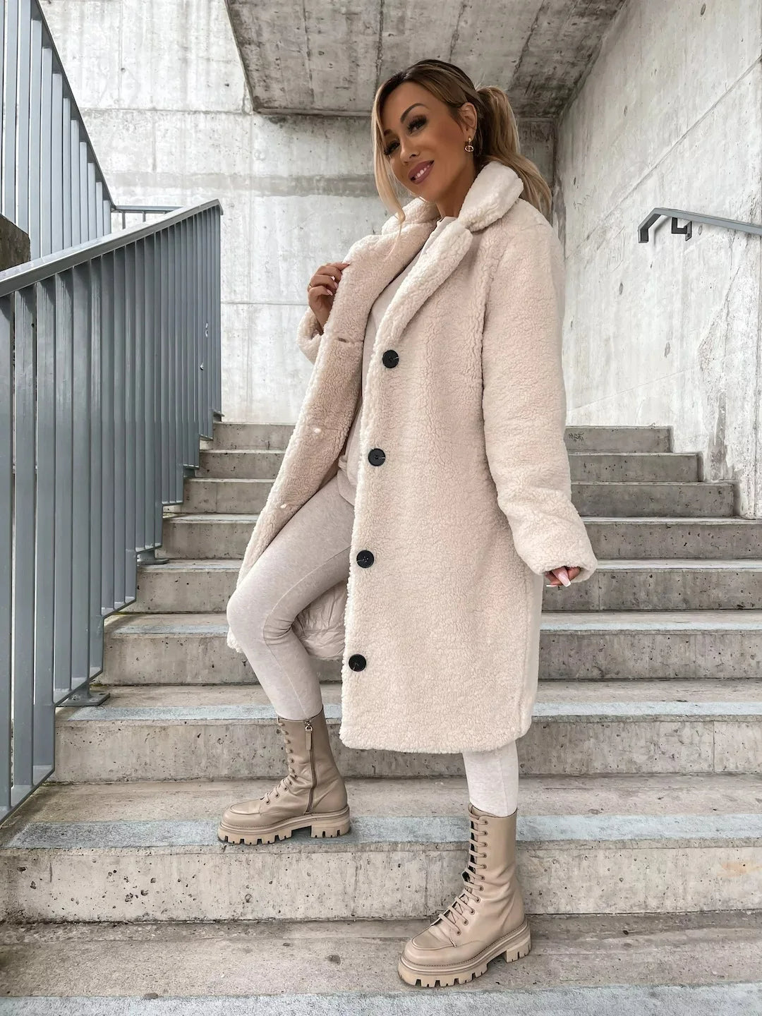 Versatile women's longline plush teddy coat, a cozy fashion staple for elegant autumn and winter.