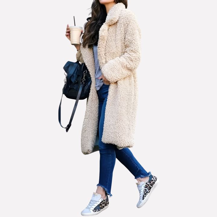 Fashionable women's longline teddy coat with notched collar, a warm & cozy outerwear staple.