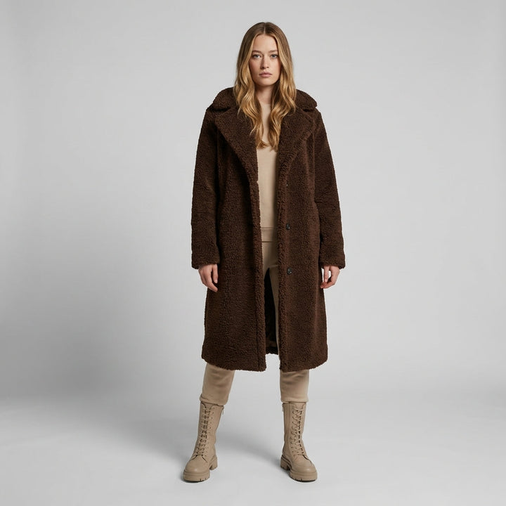 Women's cozy longline teddy coat. Soft, warm winter outerwear for stylish fall fashion.