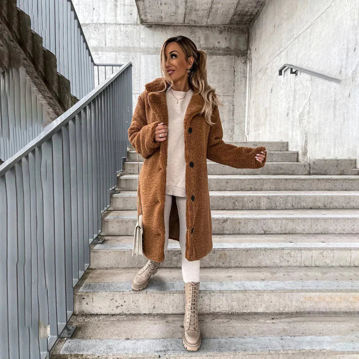 Stylish women's longline teddy coat. Embrace cozy warmth & fall fashion with this soft winter outerwear.